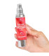 Huile de massage fraise — texture satinée premium
